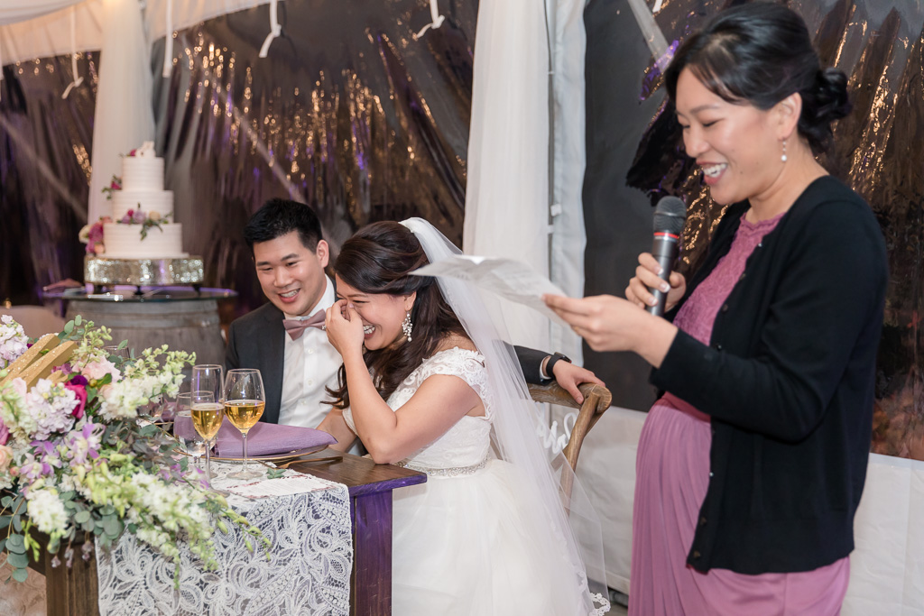 sister giving a hilarious speech to the newlyweds