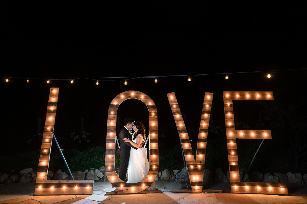 Nella Terra Cellars wedding photo with the big love sign