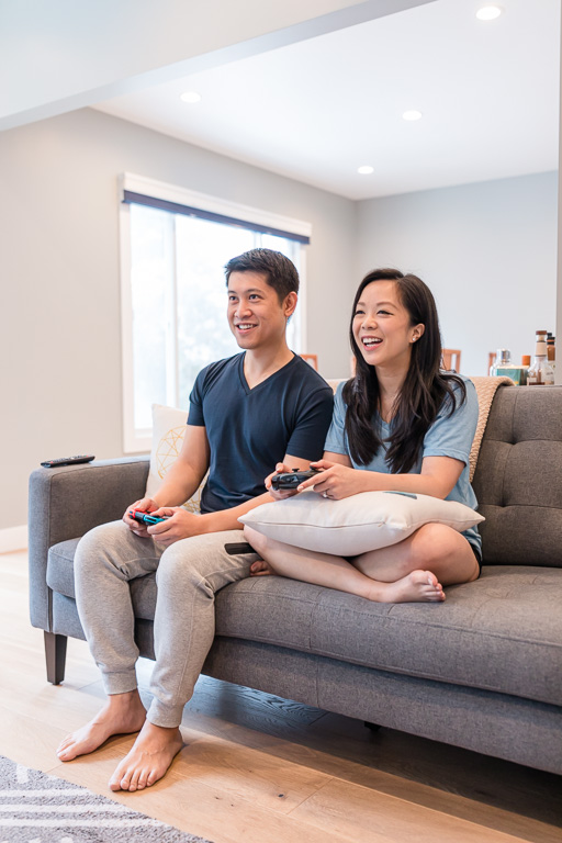 lifestyle couple engagement session playing video games together