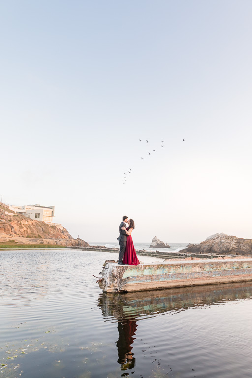 romantic San Francisco engagement photo kissing by the water