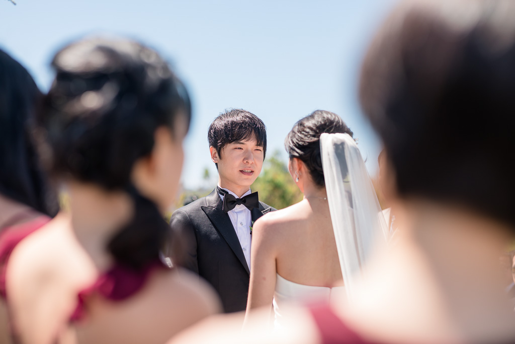 groom staring at his bride during their ceremony