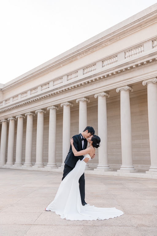 bride and groom dancing in the museum courtyard