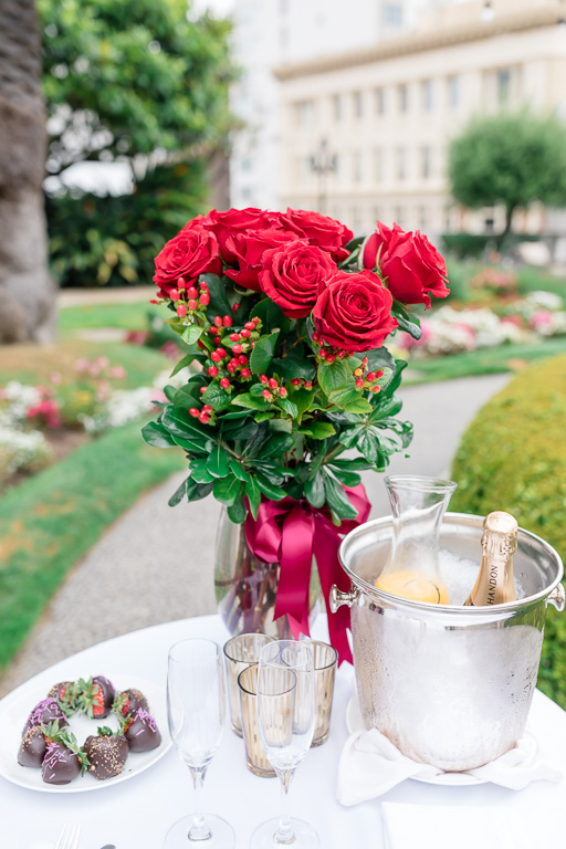 Fairmont SF set up the surprise table with roses, chocolates, and champagne for our newly engaged couple