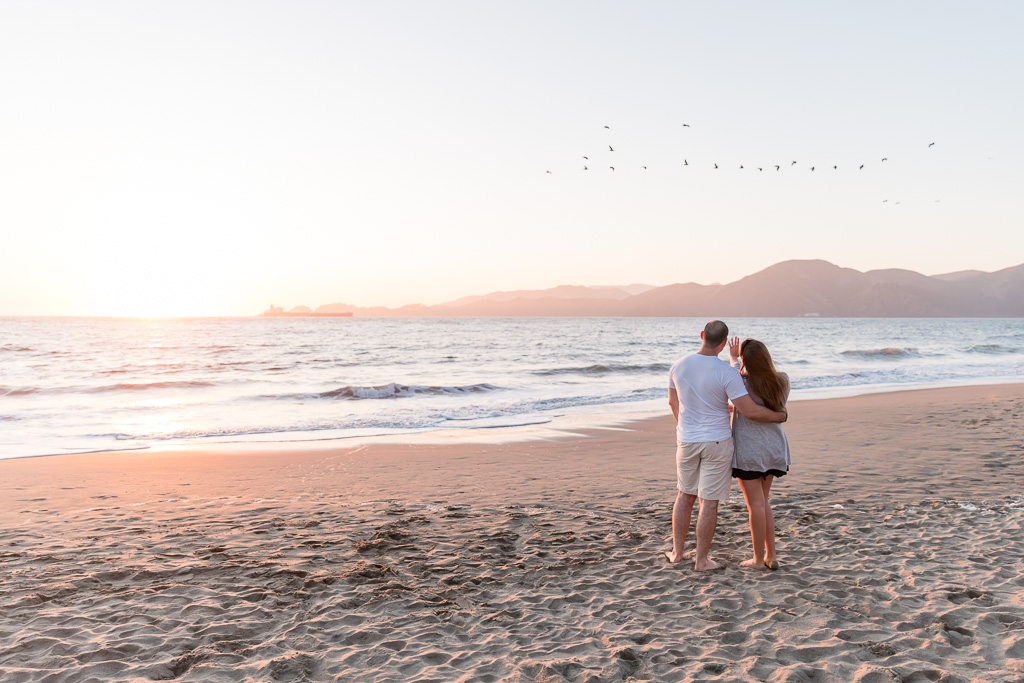 San Francisco surprise proposal under the most gorgeous sunset golden light on the beach