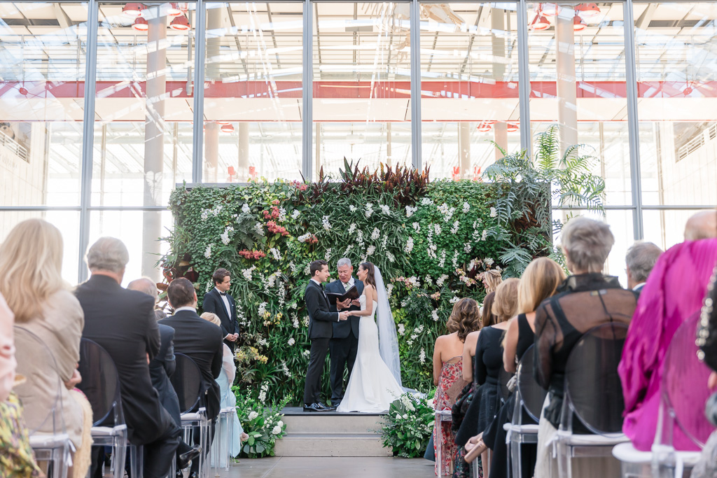 California Academy of Sciences wedding ceremony in front of the living wall
