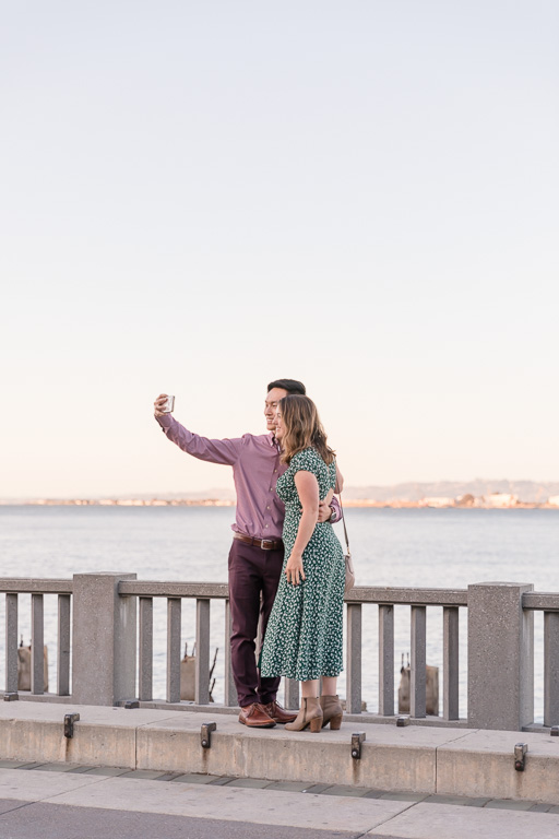 couple snapping a selfie at the waterfront