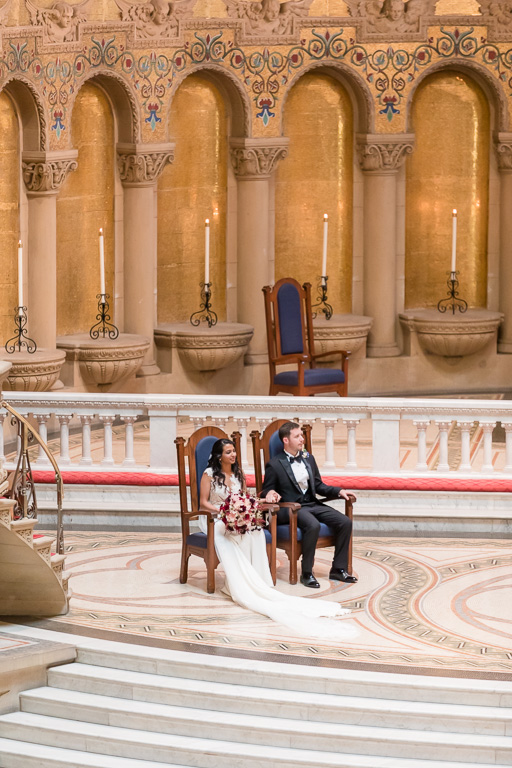bride and groom in their chairs at ceremony