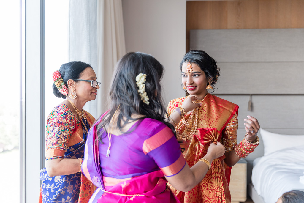 bride wearing a red sari for the hindu ceremony