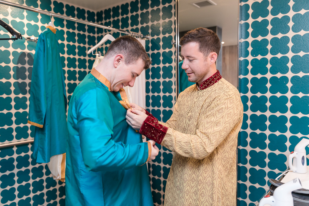 groom and brother getting ready together