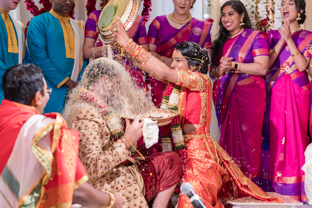 hilarious rice pouring at the San Francisco Hindu wedding ceremony