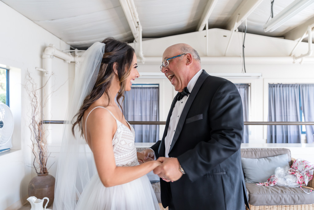 bride having a first look with her dad