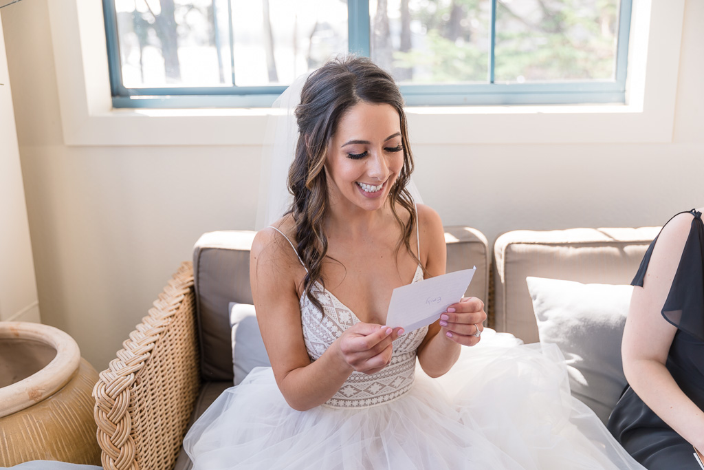 bride reading all the cards from her bridesmaids