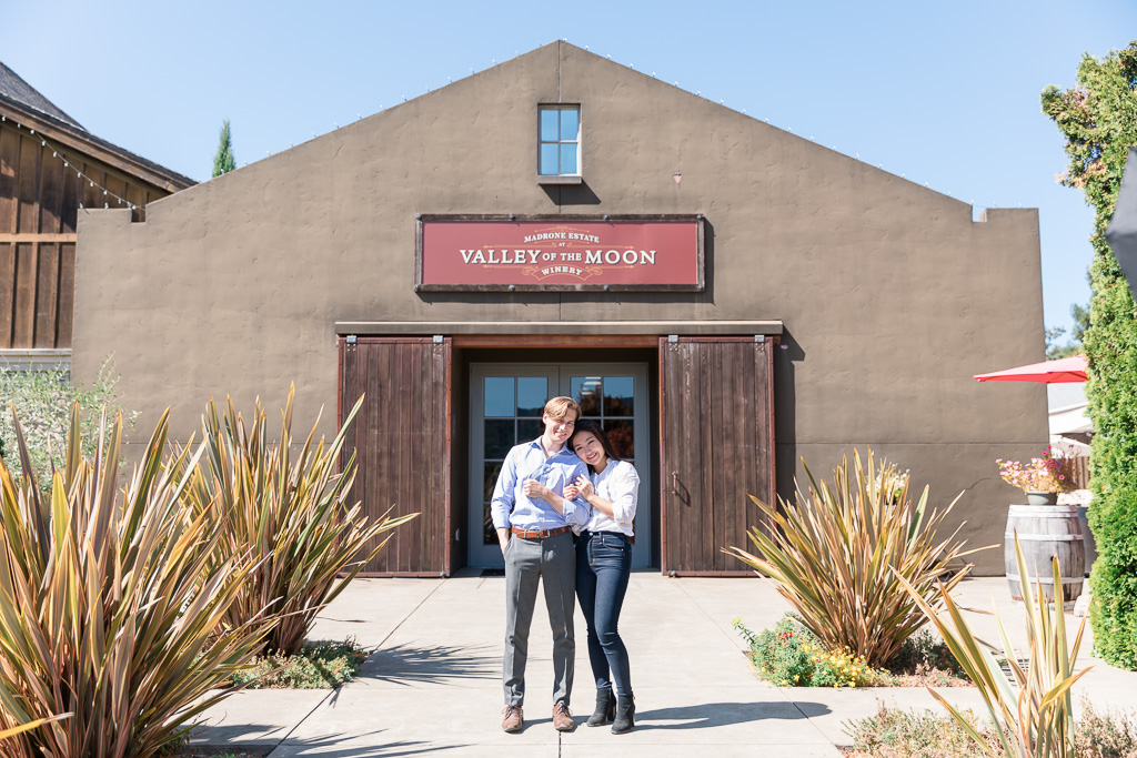 a picture of the couple in front of their favorite Sonoma winery