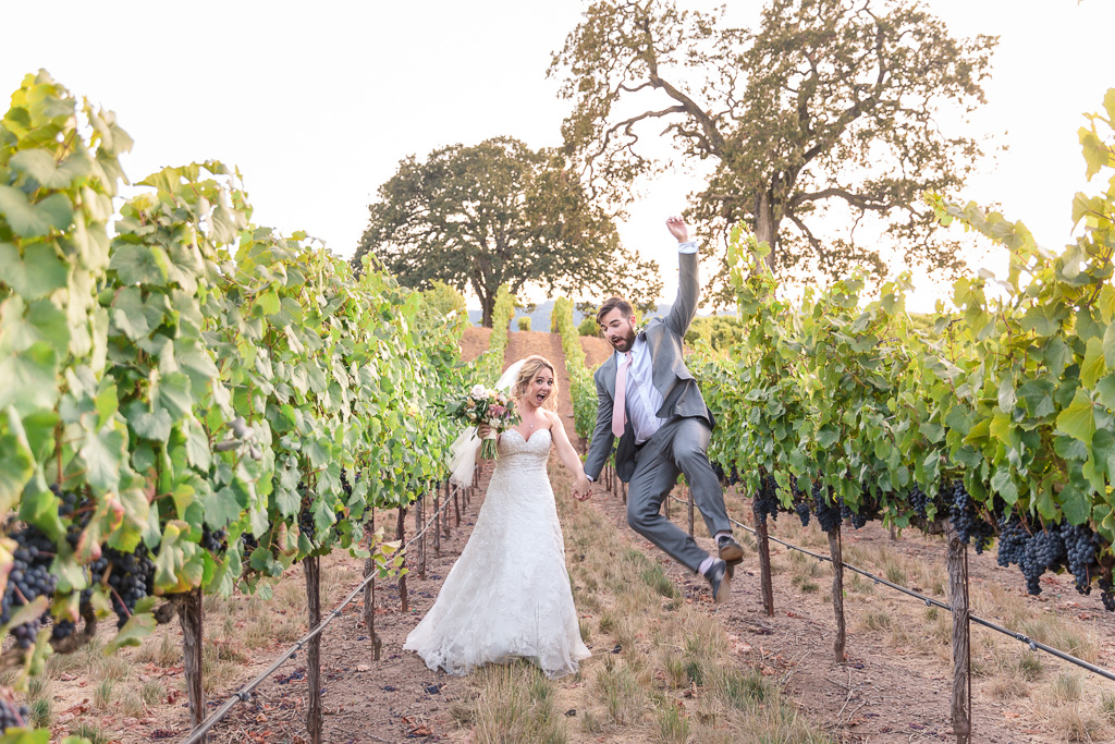 California winery golden hour playful wedding photo