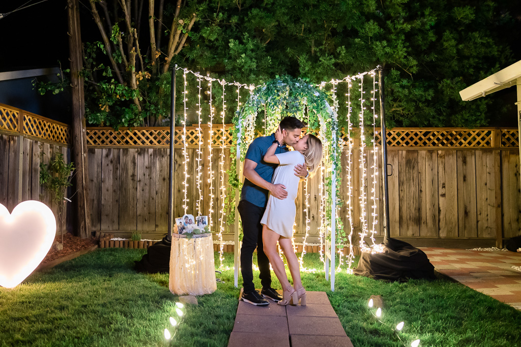 romantic and intimate San Francisco surprise engagement proposal with twinkle lights at night