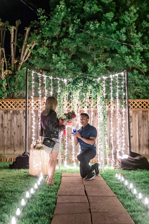 backyard nighttime surprise proposal