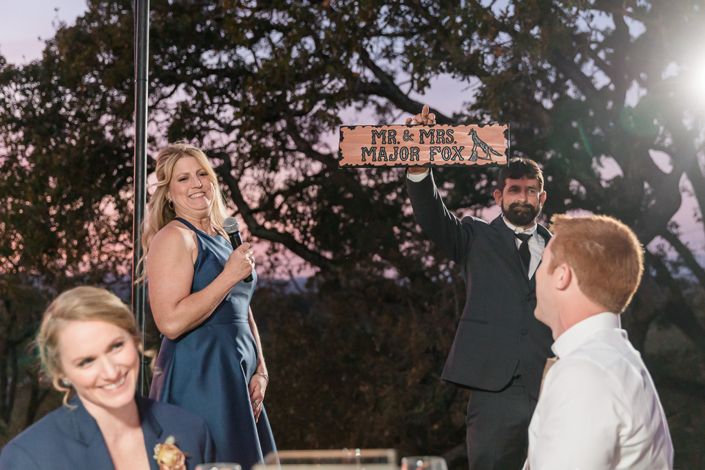 groom's parents surprised them with a handmade wooden sign
