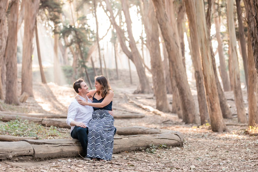 Lovers' Lane San Francisco engagement photo with sunlight pouring through the trees