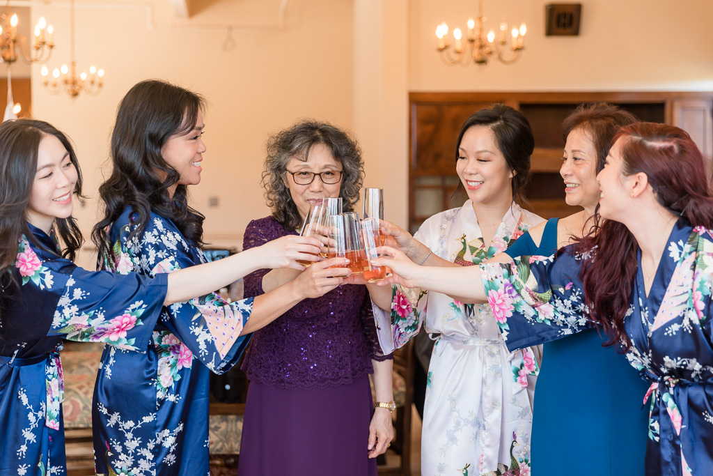 cheers with mothers and bridesmaids