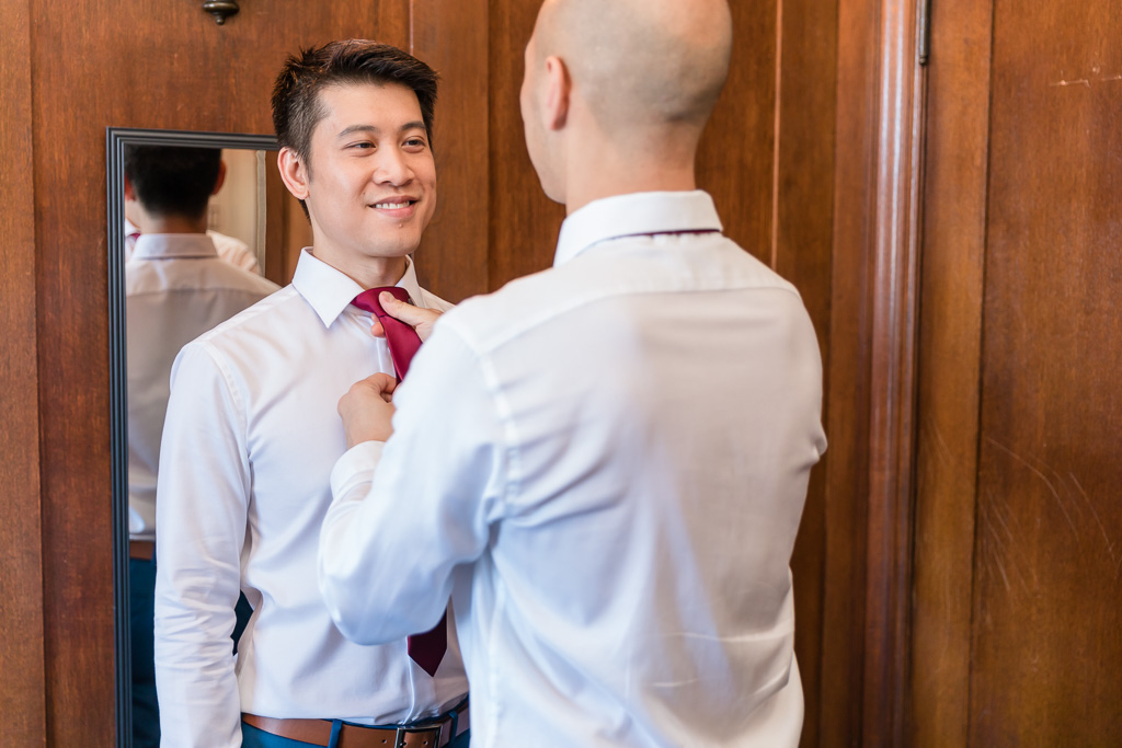 groom getting ready in the library room
