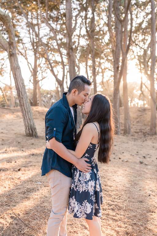 San Francisco engagement portrait with sunlight shining through the trees