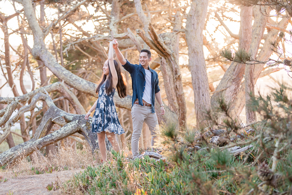 couple dancing in the sunlit forest in San Francisco