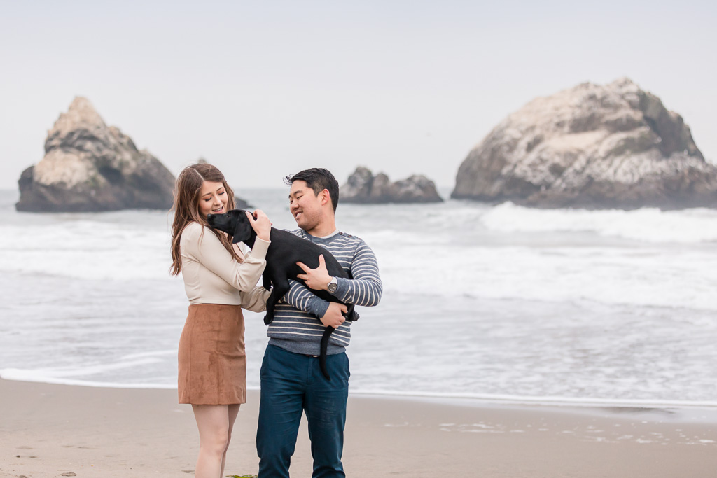 engagement couple portrait with puppy on the beach