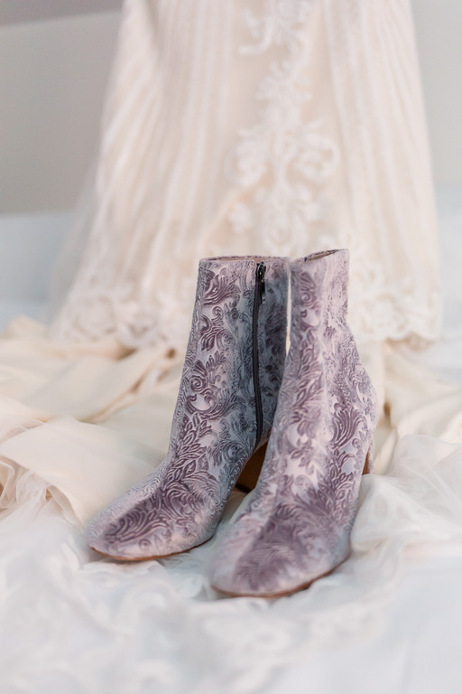 bridal gown and velvet floral boots