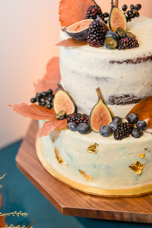 wedding at The Pearl SF - stylish wedding cake with fruit, foliage and fall leaves