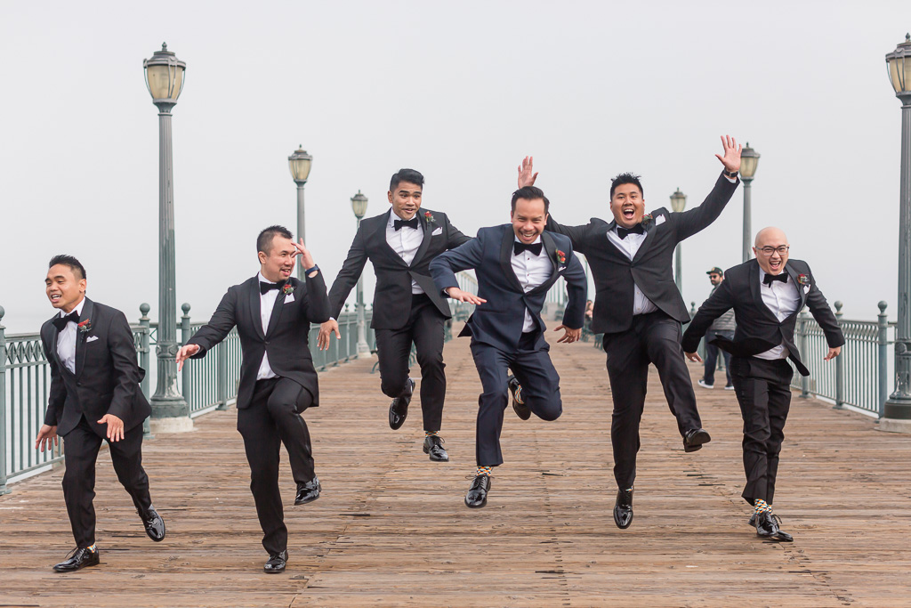 groom and her groomsmen being silly