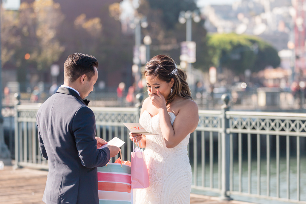 super cute wedding card exchange by the bride and groom at Pier 7