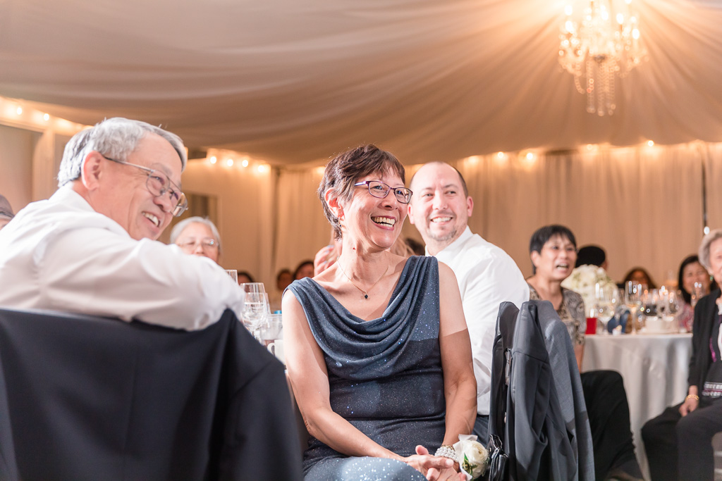 bride's parents laughing during reception speeches