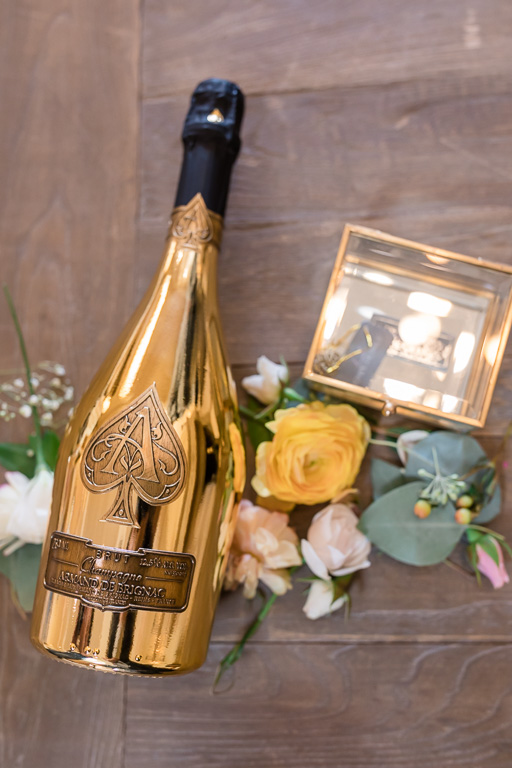 gold champagne bottle at wedding