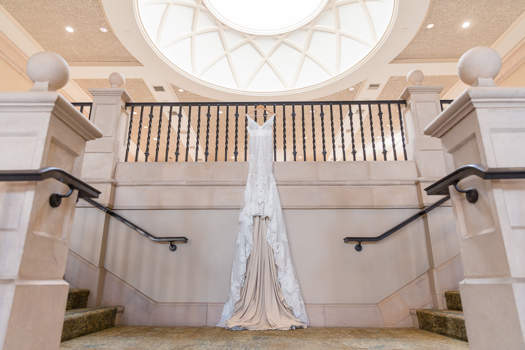 wedding gown hanging in the grand hall
