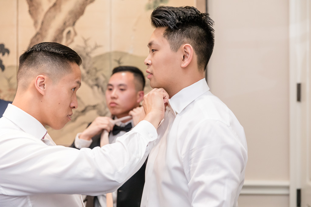 groom getting ready with his groomsmen