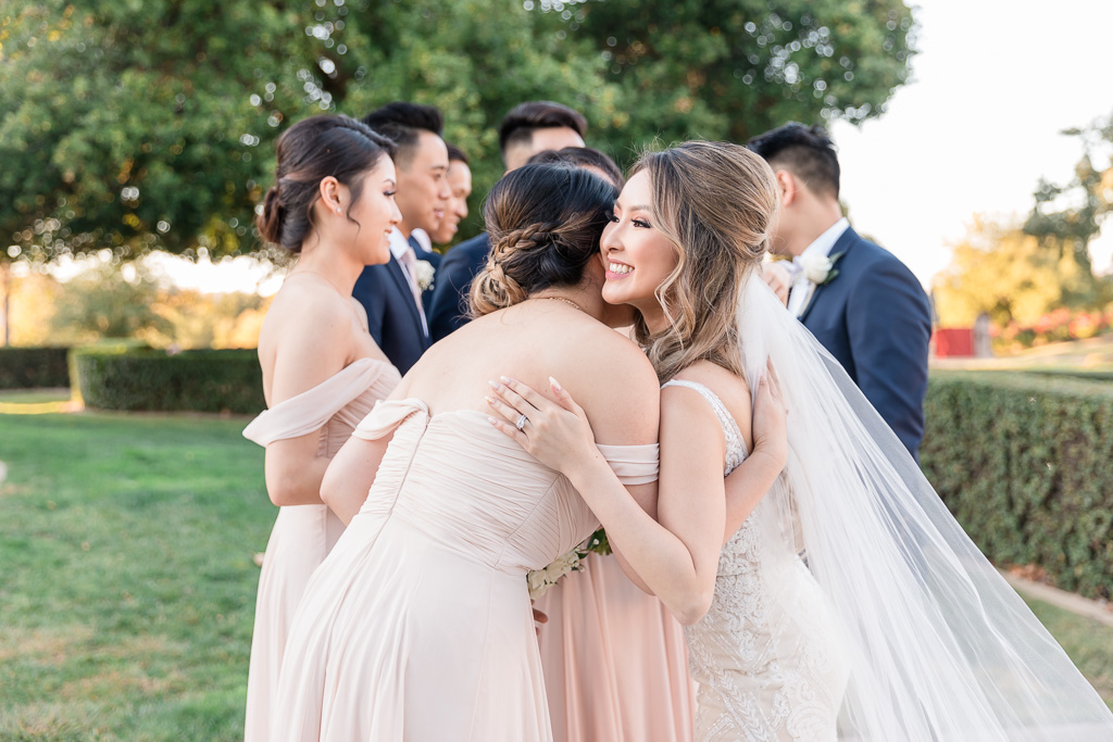 bride hugging her friends