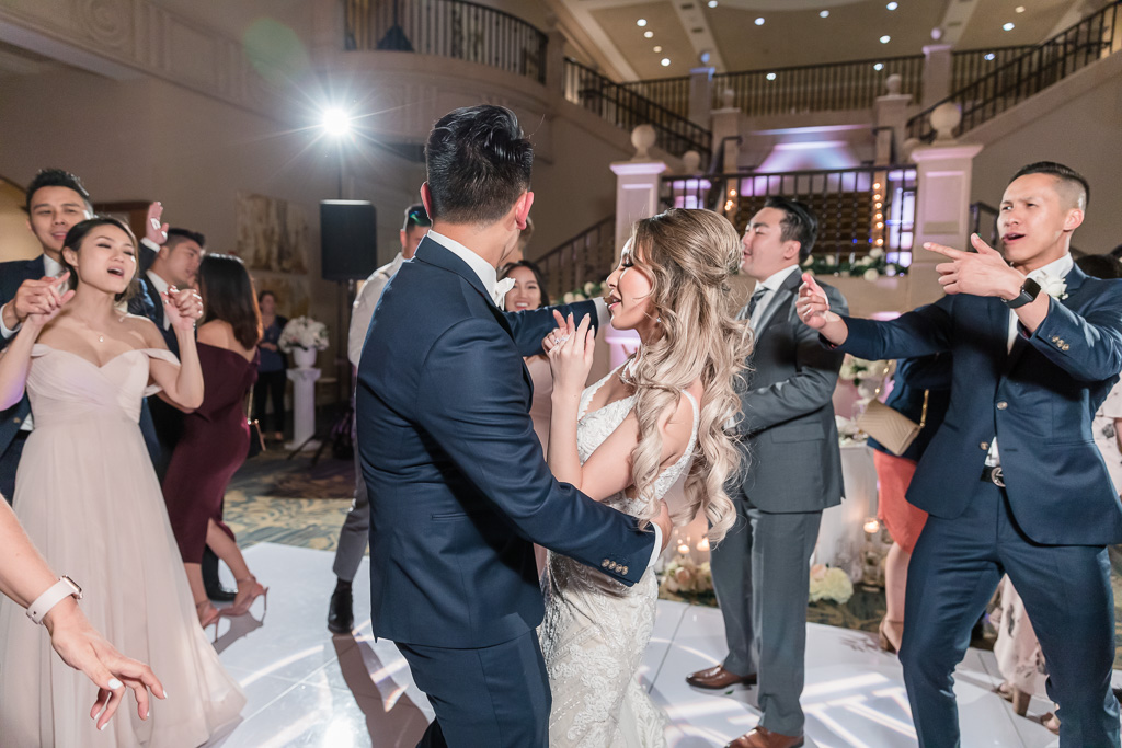 newlyweds dancing with guests