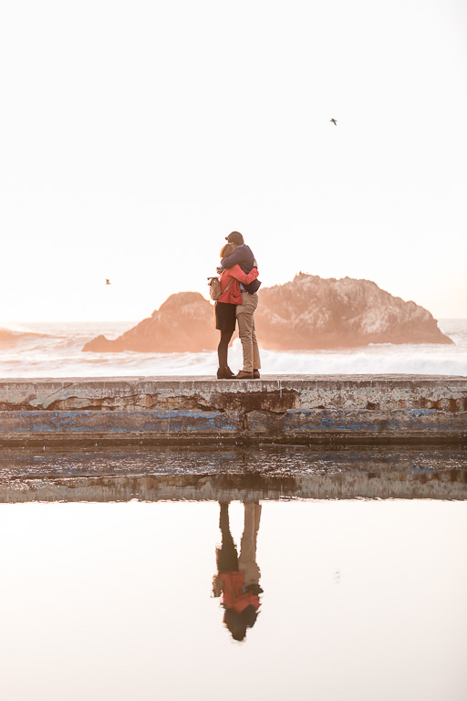 couple at Sutro Baths with water reflection
