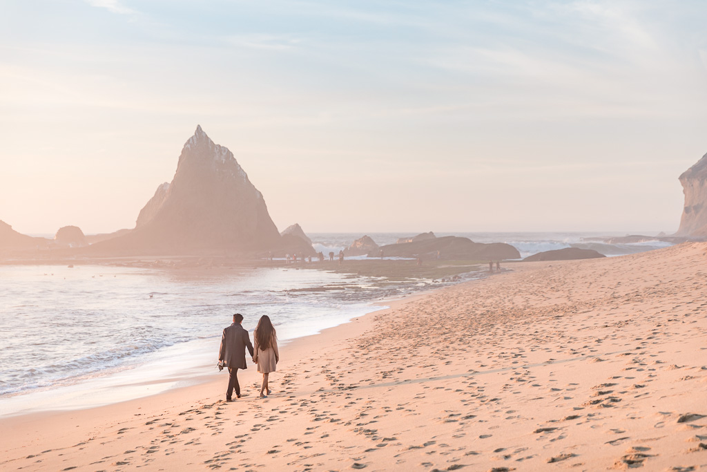 couple walking along the private and secluded Martin’s Beach in Half Moon Bay