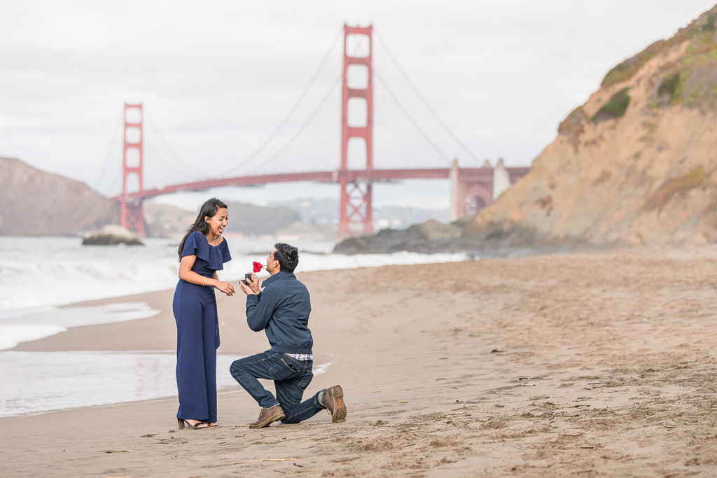 San Francisco surprise proposal in front of the Golden Gate Bridge at Baker Beach