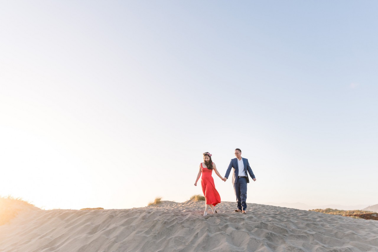 engagement photo shoot on sand dunes near golden hour