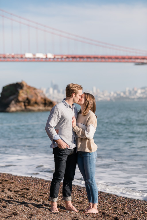 kissing in front of the bridge