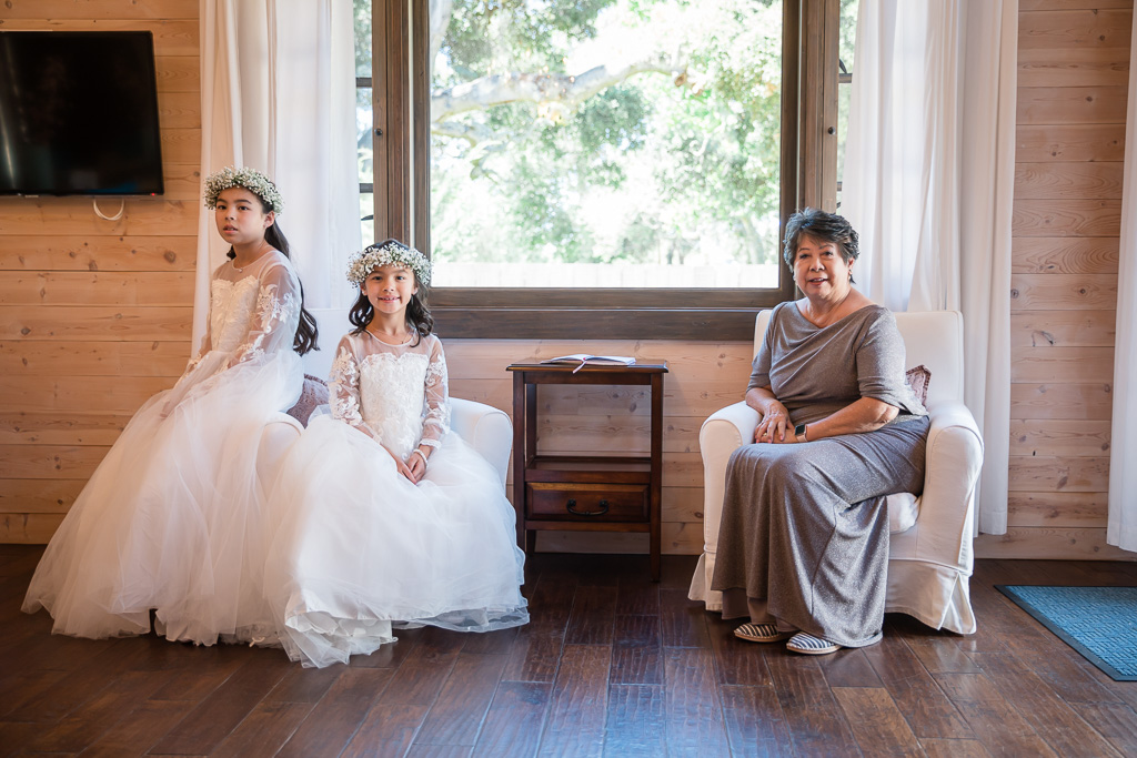 grandma and flower girls waiting for bride to finish preparations