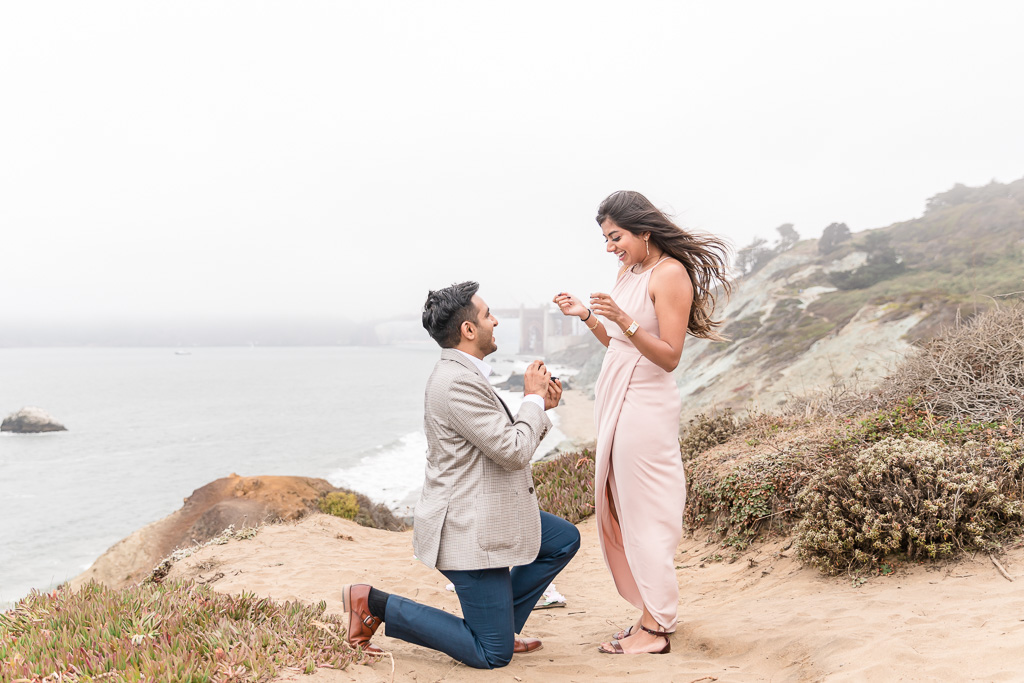 romantic surprise proposal on a trail overlooking the Bay