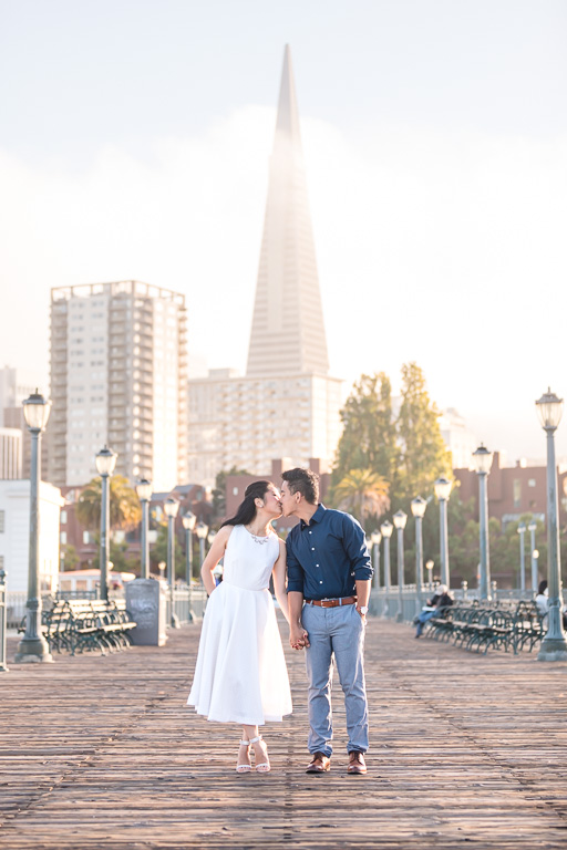 Trans-America pyramid behind couple in Pier 7 engagement photos