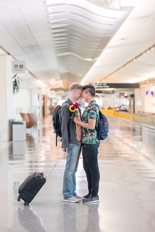 engagement photos at airport with luggage