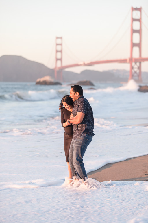 couple's photo shoot in the ocean waves