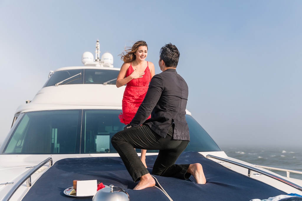 Surprise proposal at the bow of the Diamond Seas Yacht