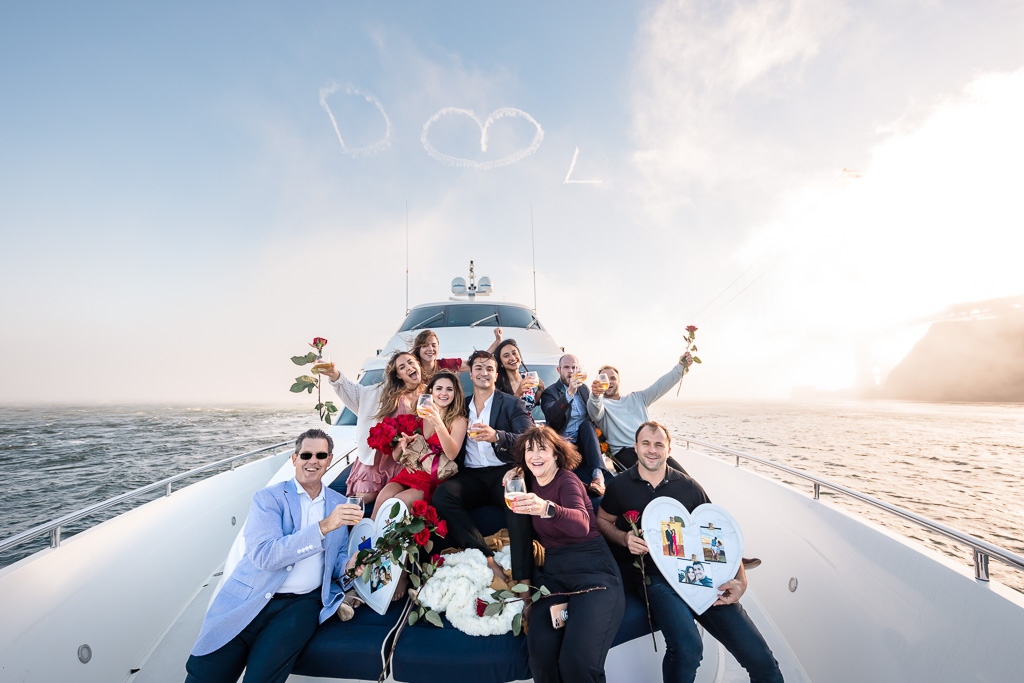 group photo at the front of a yacht