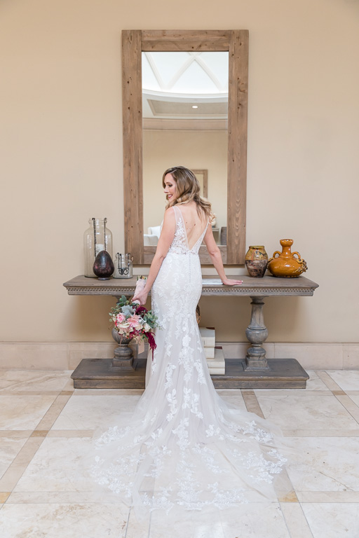 elegant bride in front of mirror